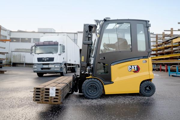 Cat electric forklift carrying load on slippery surface